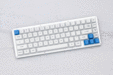 WhiteFox Mechanical Keyboard on a GMK Camping Keyset themed desk mat by Novelkeys